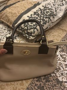 Elegant Beige Handbag with Black Handles