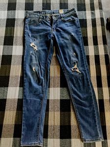 Distressed Blue Denim Jeans