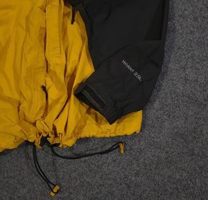 THE NORTH FACE YELLOW AND BLACK JACKET