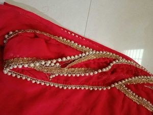 Elegant Red Saree with Pearl Border
