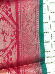 Elegant Teal Saree with Floral Motifs