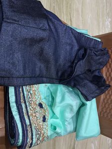 Elegant Teal Saree with Intricate Border