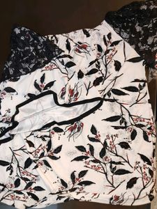 An Elegant White Off Shoulder Top
