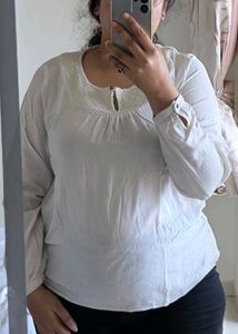 Elegant White Top with Textured Yoke