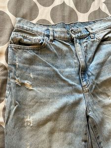 Distressed Light Wash Denim Jeans