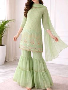 A green party wear sharara with dupatta