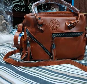 Stylish Brown Leather Handbag with Tassels