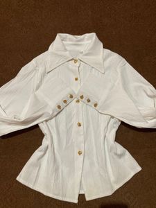 white shirt with gold button details