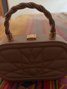 Quilted Oval Handbag