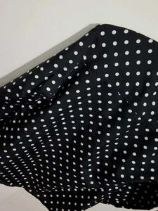 black polka dot shirt