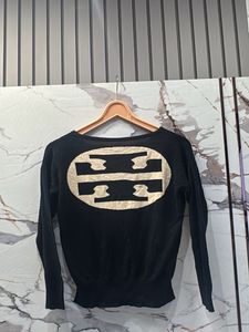Black Sweater with Red Pocket Detail