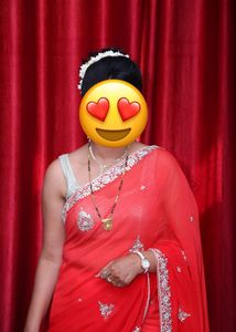 Vibrant Red Saree with Intricate Embellishments