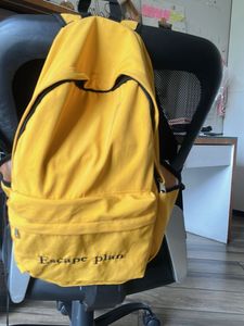 Yellow Backpack with "Escape plan" Text