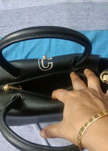 Stylish Black Handbag with Gold Chain Detail