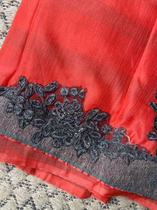 Vibrant Coral Saree with Embellished Border