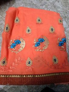 Elegant Orange Embroidered Saree