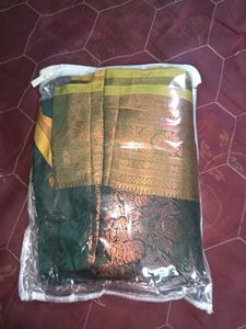 Elegant Dark Green Saree with Gold Border