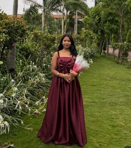 Elegant Maroon Gown with Bow Detail