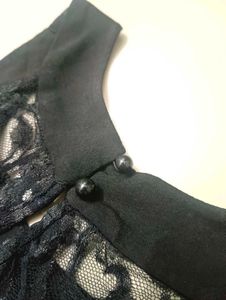 Black halter neck top.