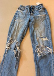 Distressed Blue Denim Jeans