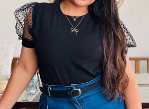 Chic Black Top with Polka Dot Sleeves