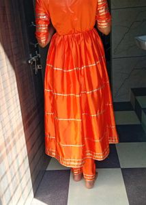Vibrant Orange Kurta Set with Golden Accents