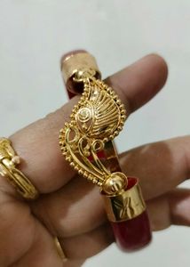 Brand new Gold Bangle with Red Accents