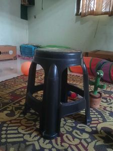 Black plastic stool