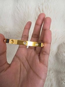 Elegant Gold Bangle with Crystals