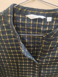 A max black kurta with golden stripes