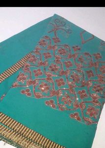 Elegant Teal Saree with Intricate Print