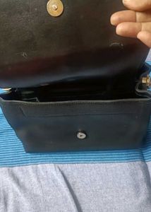 Stylish Black Handbag with Gold Chain Detail