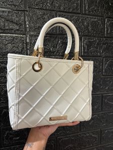 Chic White Quilted Handbag with Embellishments