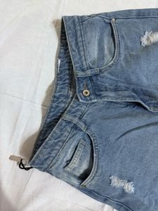 Distressed Blue Denim Jeans
