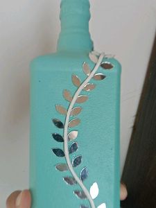 Decorative Teal Bottle with Vine Accent