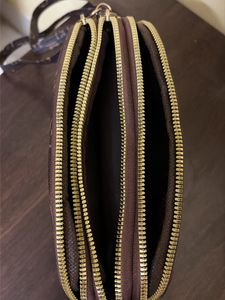 Spacious 3 compartment sling bag