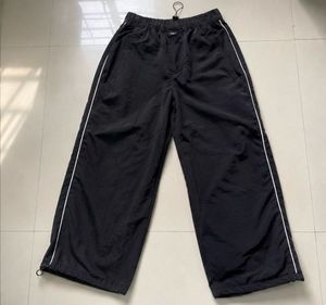 Black Track Pants with White Stripes