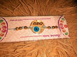 Resin Rakhi with Pearl Beads