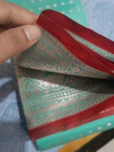 Elegant Teal Saree with Silver Motifs