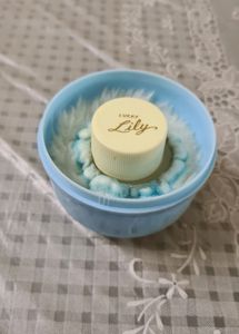 Baby powder puff with a refill container