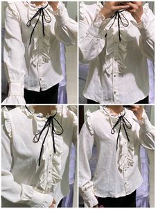 Ruffled White Blouse with Black Bow
