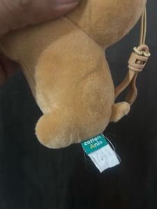 brown plush dog bag charm/keyring with a sleeping