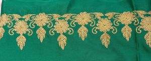 Dark green golden embroidery fabric with work on both sides (upper part and bottom part both have golden embroidery work), patches of work in between.7 meter cloth.