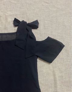 Chic Black Cold Shoulder Top with Bow Accents