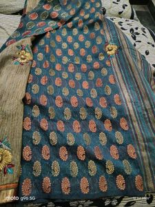 Elegant Teal Saree with Floral Motifs