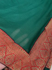 Elegant Green Saree with Red Border