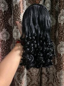 BLACK CURLY WIG WITH BRAID ACCENT