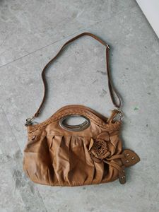 Chic Tan Leather Shoulder Bag with Flower Detail