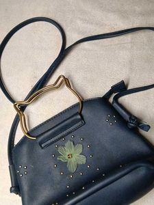 Chic Navy Blue Bag with Flower Detail