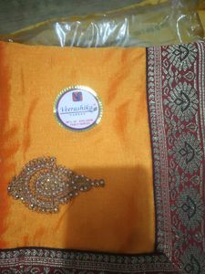 Elegant Orange Silk Saree with Embellishments